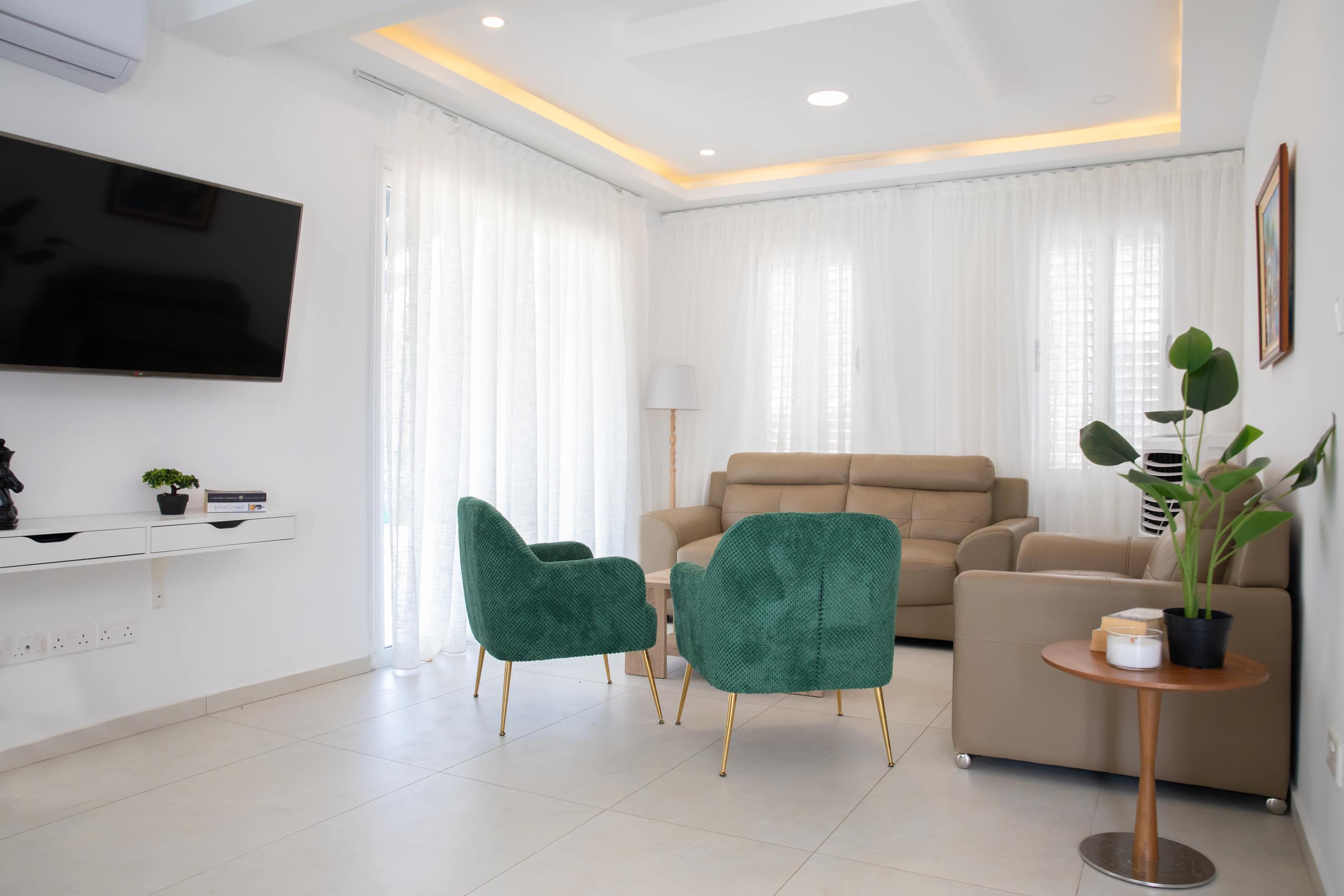 Existing open living and dining room inside the Peyia villa
